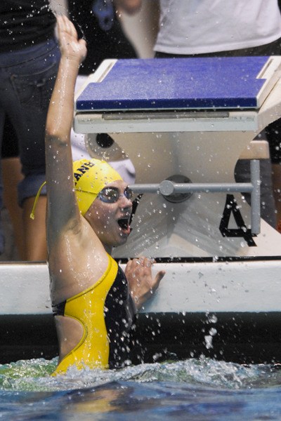 Bainbridge Island's Julia Griffths celebrates after swimming the final leg of the winning 200 medley relay Saturday at the 3A swimming/diving state championship meet in Federal Way.