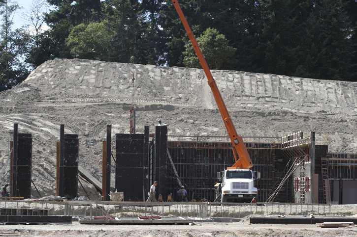 The framing of the two-story high gymnasium/commons structure is now under way between the existing Wilkes Elementary School and the new school’s classrooms