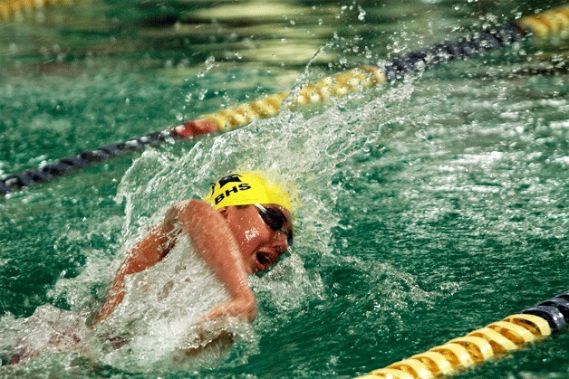 Spartan swimmer Parker Bushey competes in the varsity heat of the 100-Yard Freestyle during the meet at home against Mercer Island at the Bainbridge Aquatic Center Thursday