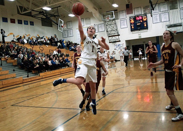 Bainbridge senior guard Maddie Ketcheside leaps for a layup during the final home game of the regular season Friday