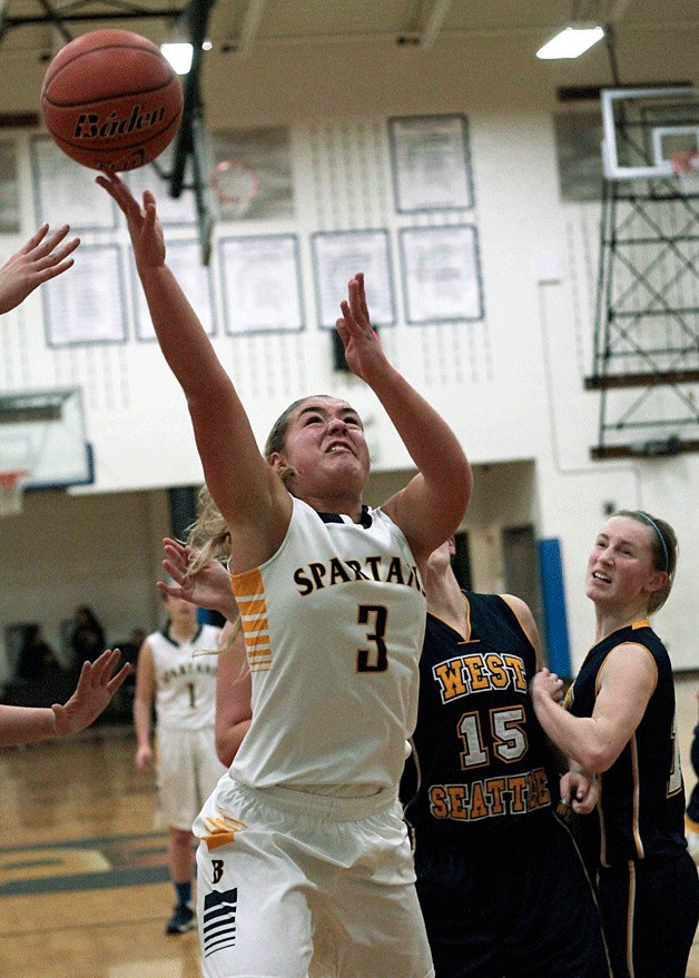 Spartan sophomore wing Katie Usellis fights for a rebound during the home game against West Seattle.