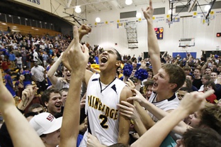 BHS Spartan Will DiIorio sinks a three-point shot to cinch a win Friday against Rainier Beach.