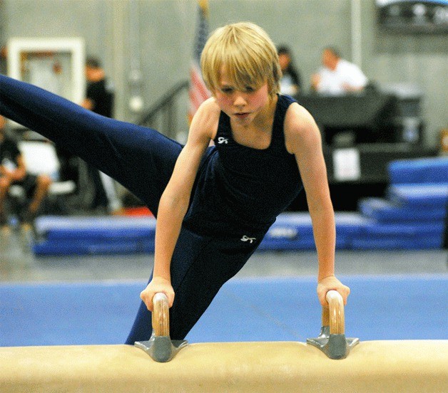 Bainbridge Island’s Mace Korytko works through his routine on pommel horse during the Washington State Meet in Vancouver.