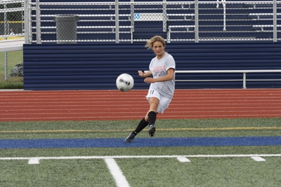 Senior girls' soccer captain Maddie Ginder sets up a corner kick at practice