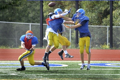 Bainbridge High School football players engage in a heated scrimmage in preparation for Friday's North Kitsap game.