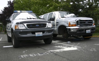 Two of the eight vehicles vandalized at the Bainbridge Police Deparment early Wednesday morning await repairs. Tires were slashed on several of the vehicles.