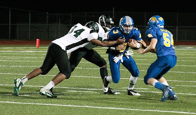 Bainbridge quarterback Kyle Jackson runs through the defensive efforts of Franklin High. The final score was 59-14 Bainbridge.