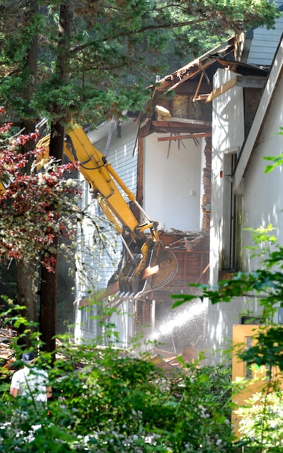 Crews started the demolition of the old Serenity House in Lynwood Center on Wednesday.