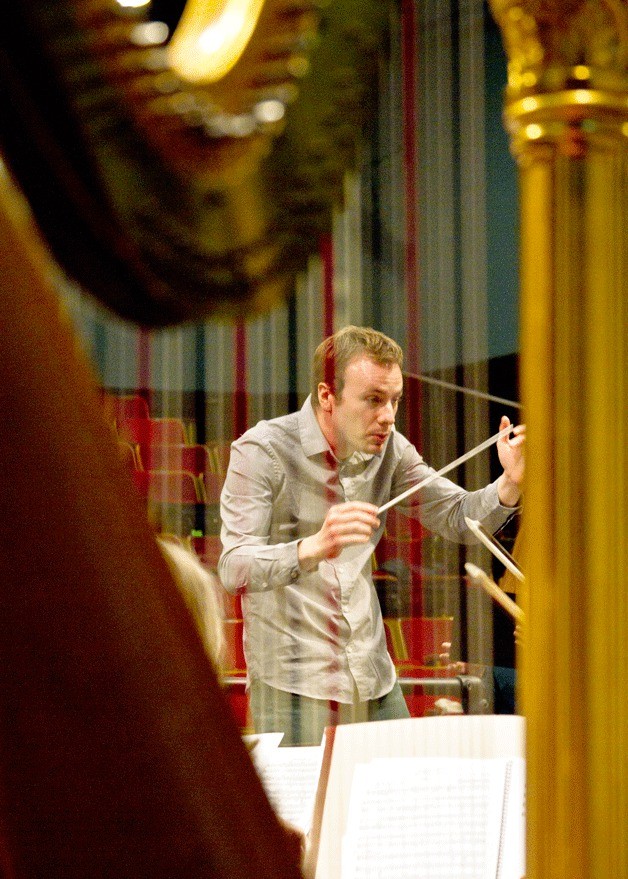 Conductor Wesley Schulz directs the Bainbridge Symphony Orchestra through a rehearsal session.