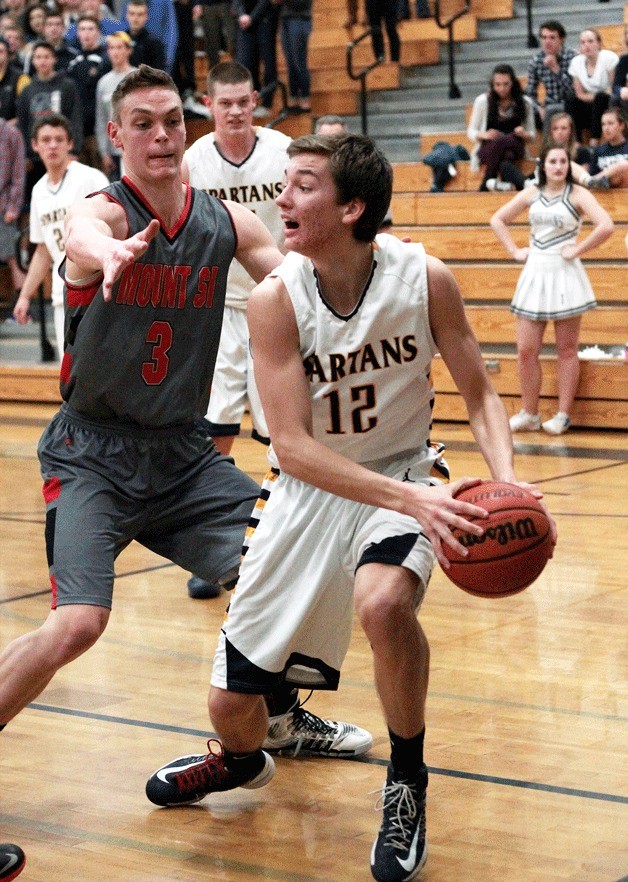 BHS junior wing Dawson Gonwick yells for assistance as he is cornered by the defensive efforts of the visiting Mount Si Wildcats Saturday