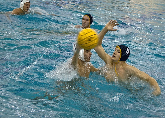 Bainbridge driver Noah Clark blocks a pass during the final game of the 2013 state water polo championship against Newport High Saturday