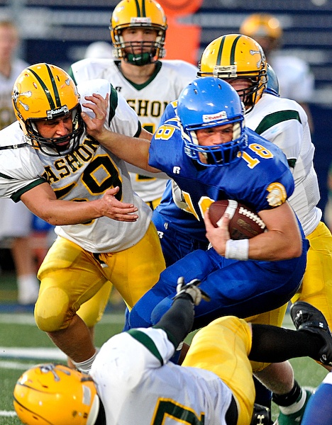 Bainbridge Spartans Jordan Wagner powers through the Vashon line during home action Friday at Bainbridge High School. The Spartans fell to the Pirates 28-7. The team matches up next week against Kingston High School.