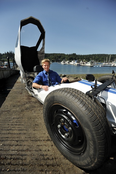 Mark King will embody  the green theme of this year’s Grand Old Fourth Saturday in his custom built electric car. He crafted the vehicle in high school as a personal challenge to offset parking costs. King built the car over nine months at a cost of about $2400.