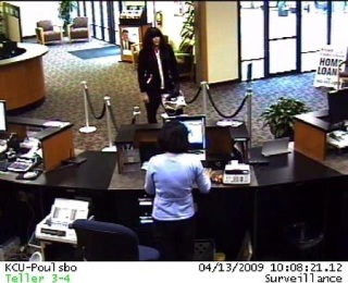 A photo released by the FBI shows a suspected bank robber entering the Kitsap Credit Union in Poulsbo Monday morning.