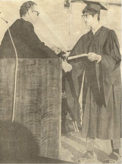 BHS 1969 graduate Brian Siler receives his diploma from principal Fred Gunther.