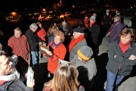 Supporters sign a petition at last week's rally for the arts.