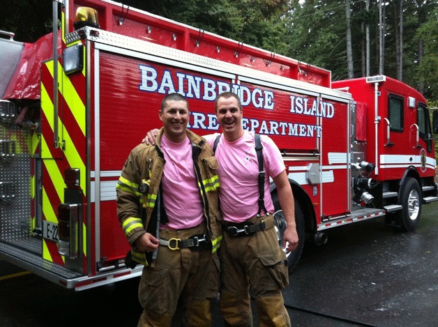 Firefighter Cole Linich and Lieutenant Dag Liljequist show their support of Breast Cancer Awareness Month by donning pink.