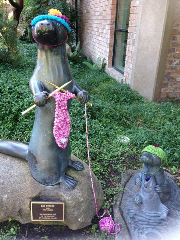 The otter sculpture at the library was 'yarn bombed' by youth participating in a 'Yarn Bomb the Library' camp at the Bainbridge Public Library as part of the library system's Summer of Learning.