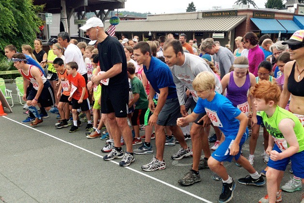 Racers crowd the start line for the beginning of this year’s Fun Run during Bainbridge Island’s Grand Old Fourth celebration.