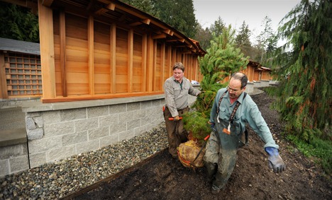 Bloedel Reserve crew  Don McKinney (left) and Joe Piecuch joined a dozen other people Thursday at the Bainbridge Island Jamanese American Exclusion Memorial at Pritchard  Park. Landcape architect Johnpaul Jones