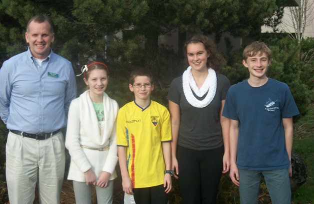 Woodward Middle School Principal Mike Florian stands with November Students of the Month Elise Woods