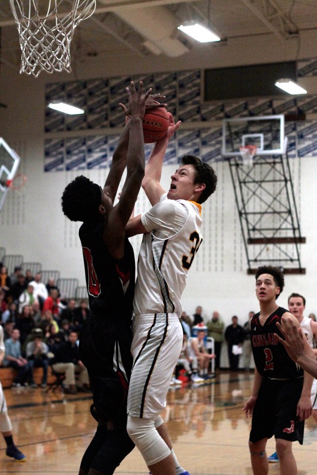 Bainbridge High junior forward Lyle Terry is stopped short under the net in Friday’s home game against Cleveland High School.