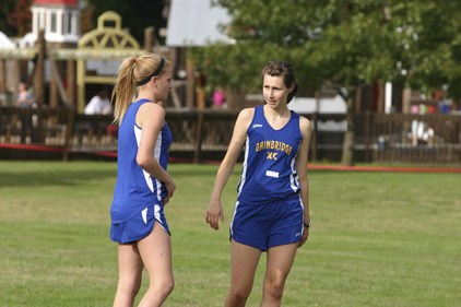 Courtney Parker (left) and Isabel Ferguson are two of the top runners for the Bainbridge girls cross country team.