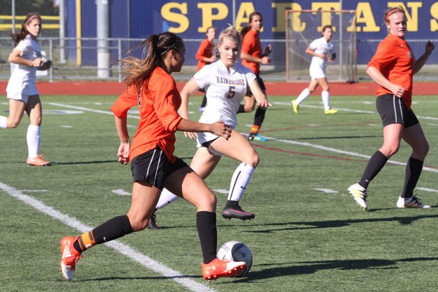 The Spartans’ Haley Morris cuts off a Cougar’s path during Saturday’s home matchup.