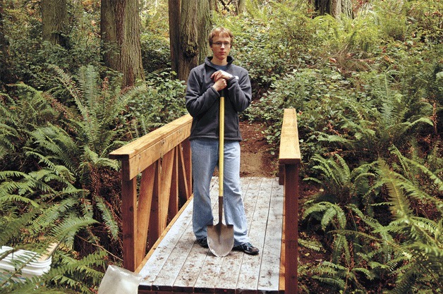 Boy Scout Bradley Mowell stands on the bridge he helped construct for the West Port Madison Nature Preserve for his Eagle Scout project.