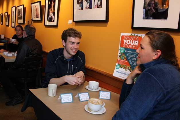 Johan Griesser and Rosie Brown relax and share conversation at Roosters Cafe.