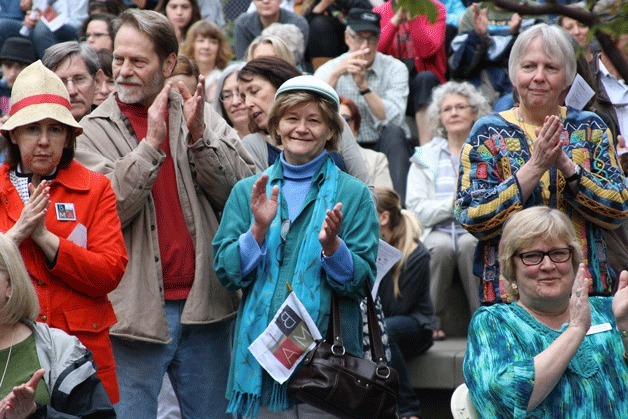 The crowd applauds during the opening day ceremonies of the Bainbridge Island Museum of Art. The opening of the museum attracted a crowd of hundreds.