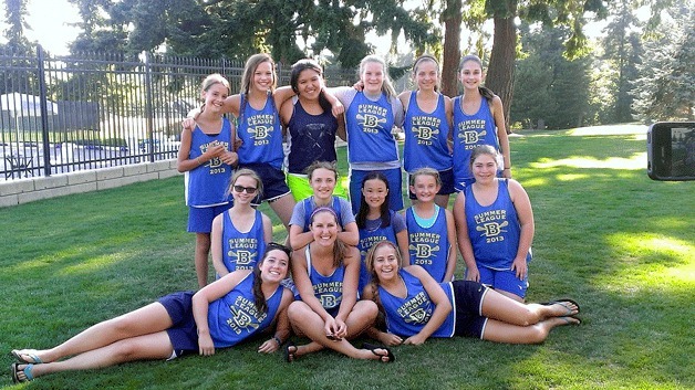 Middle schoolers who took part in the Bainbridge Island Girls Lacrosse Summer League gather for a group photo behind league coaches Grace Deery-Schmitt