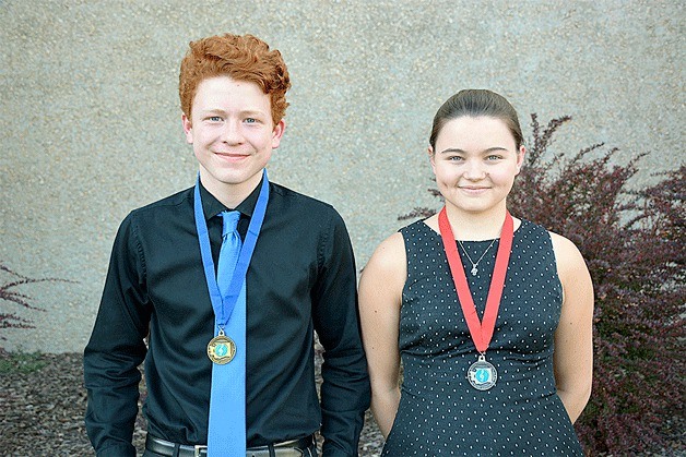 BHS sophomore Henry Brown and senior Shelby Sundquist show off their first- and second-place medals from the state music competition.