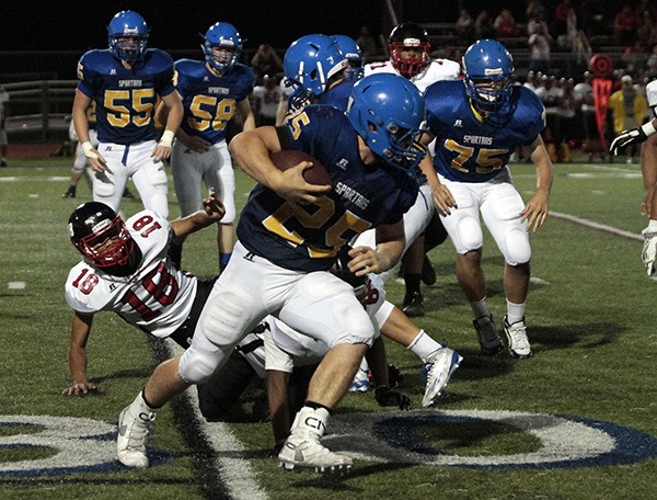 Bainbridge senior Sam Wysong runs through the defenses of the visitors from Cleveland High during last week's home game