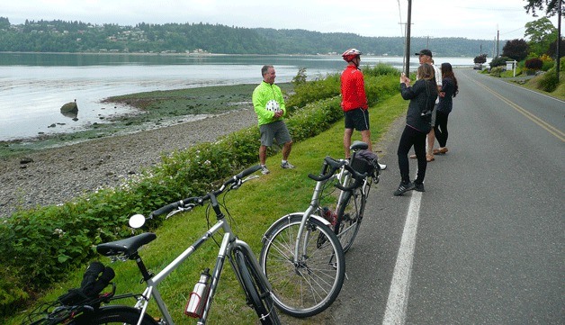 Cyclists take a pit stop to enjoy the view on Pt. White Drive.