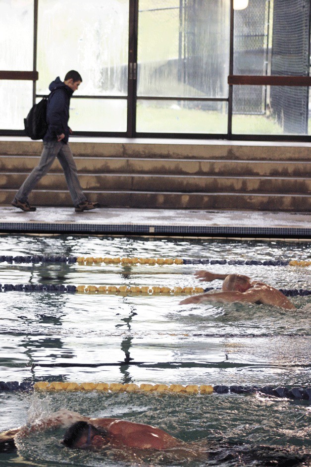 Lap swimmers go through their paces recently at the Ray Williamson Pool in the Bainbridge Island Aquatics Center. The parks district will install a thermal heating system that is expected to fully heat water in the facility’s pools in the summertime.