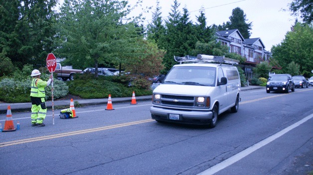 A worker from Granite Construction helps direct traffic on Madison Avenue and Wyatt Way Wednesday morning.