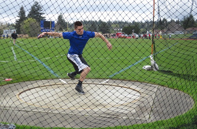 Taylor Wilson competes in the discuss for Bainbridge High during the Bremerton Invitational. He finished fourth with a throw of 103-09.