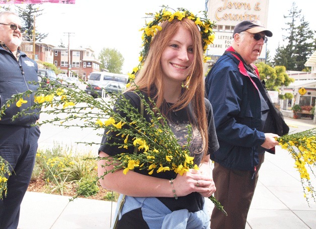 Scotch Broom Queen Erin Ayriss holds her royal bouquet of scotch broom