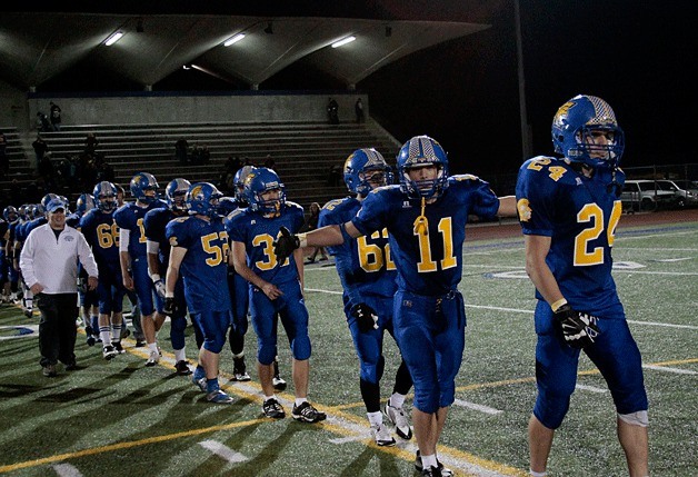 Bainbridge senior running back Dylan Read strikes a pose as the boys line up to congratulate the players from Franklin on a game well played at the end of the first Spartan post-season game of the season Friday