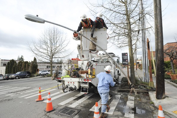 Puget Sound Energy crews worked Wednesday to remove and replace the utility poles as part of the Winslow Way reconstruction project. All of the existing poles between Ericksen and Madison avenues will be replaced to improve sidewalk access when reconstruction is complete. Businesses and residents will be notified when to expect lengthy power outages during pole replacement.