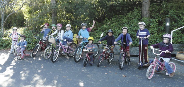 Youth from the Winslow Cohousing Community got on their bikes to raise money for the Bainbridge Island Land Trust’s Hilltop Campaign and Global Source Education’s Educulture Project recently. Riders from left to right are Cleome