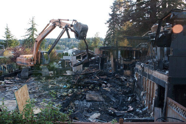 Crews demolished what remained of the 122 building on Winslow Way