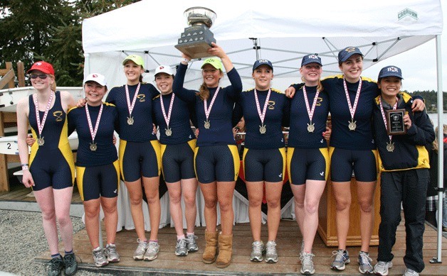 Peggy Nimb photos The first-place junior women varsity school 8+ stands with their trophy after their finals win in the Brentwood Regatta. From left to right is Maia McNett (cox)