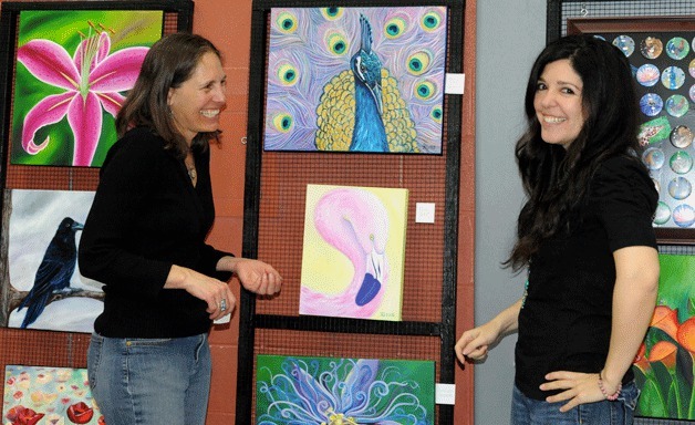 Darcy Thompson and Sienna Rivas share a laugh during last year's 'Artist’s Marketplace” spring art sale.