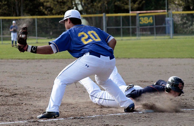 Bainbridge's own Tino Peleti guards first base during the home game against Eastside Catholic. One of the team's many multi-talented players