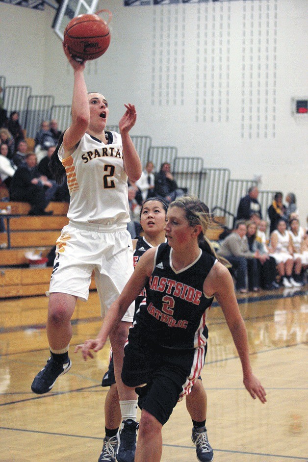 The Spartans’ Grace Kenyon soars to the rack against Eastside Catholic.