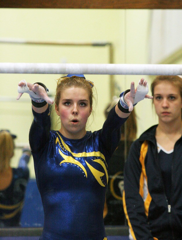 Marielle Summers concentrates before the start of her bars routine during the Spartans' final home meet of the season.