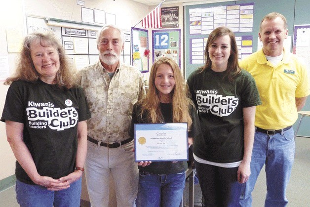 Woodward Middle School has started a Builders Club. From the left at the chartering ceremony are