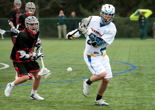 Jack Frickleton scrambles to snag the ball during Wednesday’s BHS varsity boys lacrosse game against Seattle Academy at Battle Point Park.